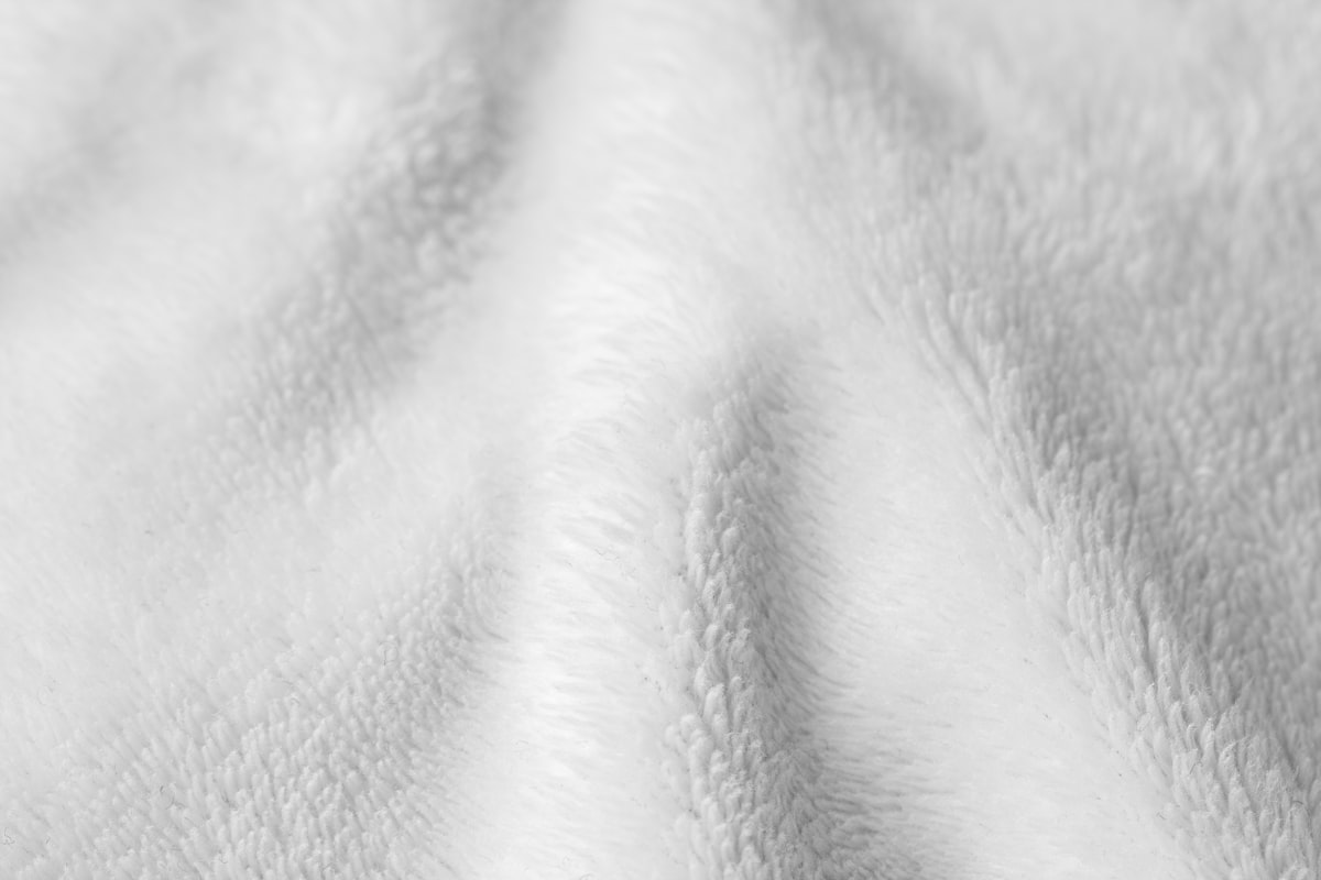 Close-up of soft white wool textile, warm and comforting