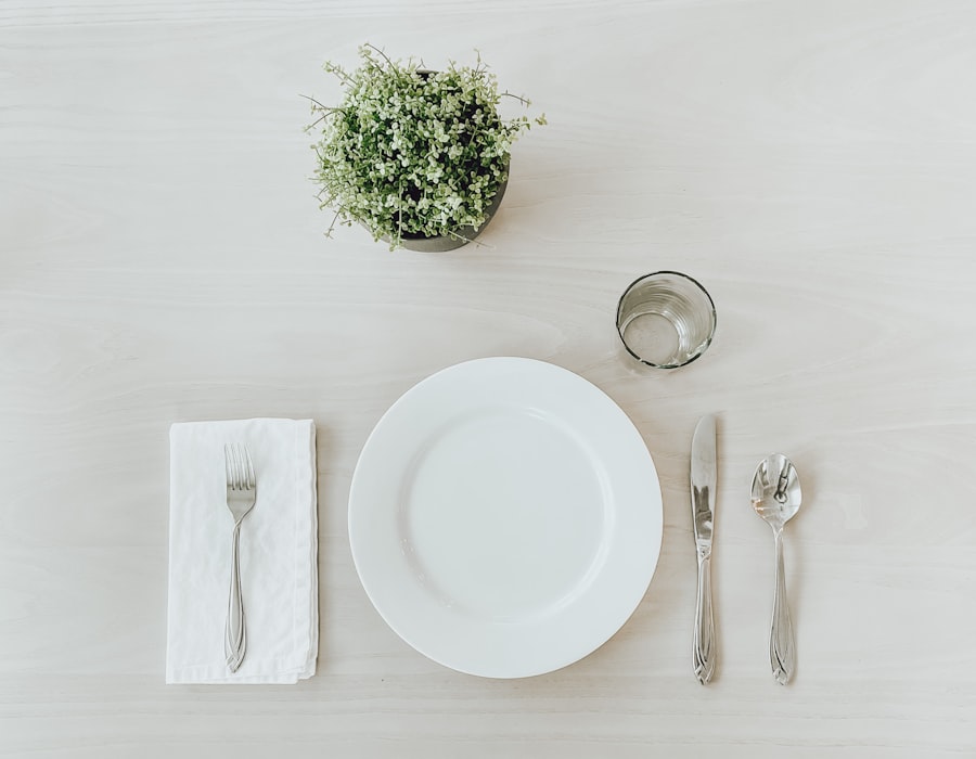 Simple, calm place setting with a small plant